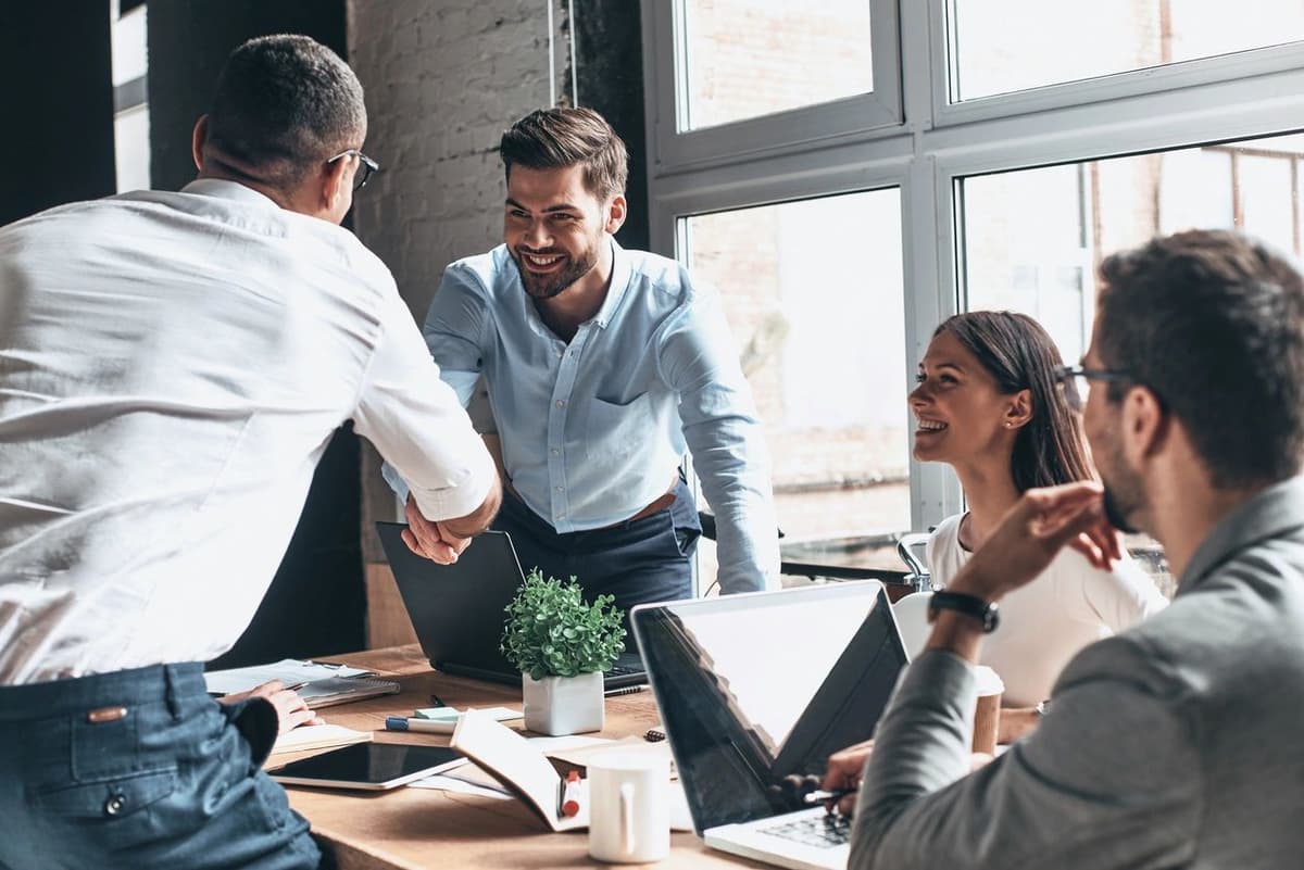 Team of professionals collaborating over strategy documents in a boardroom